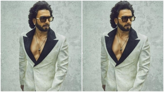 Ranveer’s suit and trousers came intricately decorated in ivory white and pastel gold prints. In a silver neck chain with a black pendant, Ranveer accessorised his look.(Instagram/@ranveersingh)