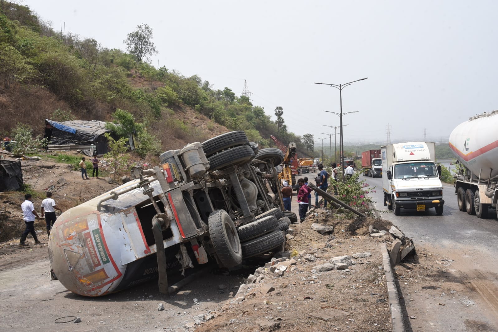 Due to overturning of cement mixer at Mumbra Bypass on Panvel-Thane road, the entire road has been closed for traffic. Due to overturning of cement mixer at Mumbra Bypass on Panvel-Thane road, the entire road has been closed for traffic.