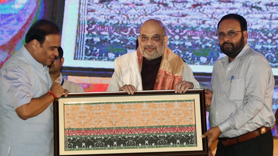 Union home minister Amit Shah being felicitated Assam chief minister Dr Himanta Biswa Sarma, in Guwahati on Monday. (ANI)
