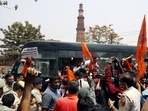 Police personnel detained members of right-wing organizations who were reciting Hanuman Chalisa outside Qutub Minar, demanding to rename the monument as 'Vishnu Stambh', in New Delhi.(Amit Sharma) Police personnel detained members of right-wing organizations who were reciting Hanuman Chalisa outside Qutub Minar, demanding to rename the monument as 'Vishnu Stambh', in New Delhi.(Amit Sharma)