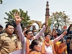 Members of right-wing organisations outside the Qutub Minar, on Tuesday.. Members of right-wing organisations outside the Qutub Minar, on Tuesday..