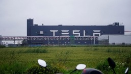 A Tesla sign is seen at its factory in Shanghai, China.&nbsp;