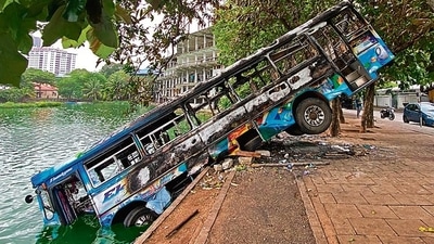 A burnt bus near former Sri Lanka PM Mahinda Rajapaksa’s official residence in Colombo. (AFP)