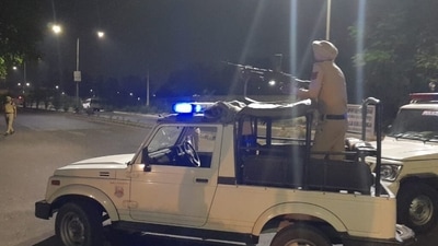 Mohali: A police personnel atop a vehicle stands guard after a blast outside the Punjab Police's intelligence department office in Mohali, Monday, (PTI) Mohali: A police personnel atop a vehicle stands guard after a blast outside the Punjab Police's intelligence department office in Mohali, Monday, (PTI)
