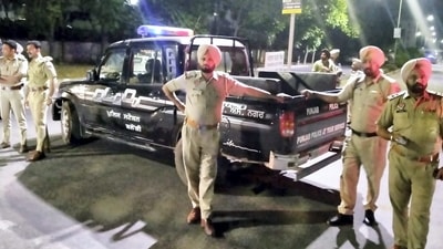 Mohali: Police personnel cordon off the area after a blast outside the Punjab Police's intelligence department office in Mohali, Monday. (PTI) Mohali: Police personnel cordon off the area after a blast outside the Punjab Police's intelligence department office in Mohali, Monday. (PTI)