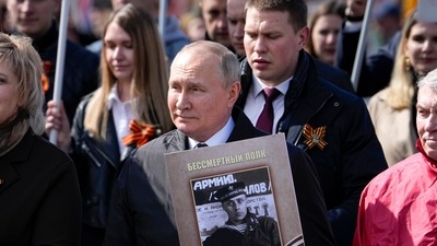 Russian President Vladimir Putin, center, attends the Immortal Regiment march through Red Square marking the 77th anniversary of the end of World War II, in Moscow, Russia, Monday, May 9, 2022. (AP) Russian President Vladimir Putin, center, attends the Immortal Regiment march through Red Square marking the 77th anniversary of the end of World War II, in Moscow, Russia, Monday, May 9, 2022. (AP)