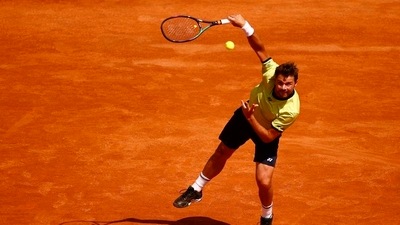 Switzerland's Stan Wawrinka in action during his first round match against Reilly Opelka (REUTERS)