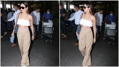 On Tuesday, paparazzi clicked Malaika, who is dating Arjun Kapoor, arriving at the Mumbai airport. She chose a trendy crop top and pants set for her jet-set look giving us tips on dressing comfortably for flights during summer without compromising on style. If you plan to upgrade your closet, don't forget to take styling tips from Malaika. (HT Photo/Varinder Chawla)