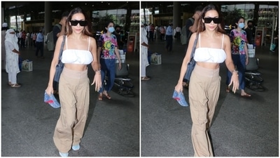 Malaika accessorised her ensemble with a greyish blue chained shoulder bag featuring patterned leather, a printed denim cap, a sleek gold bracelet and a metallic watch. The futuristic black-tinted shades added a dose of cool glamour to her look. (HT Photo/Varinder Chawla)