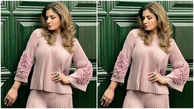 Styled by fashion stylist Sugandha Sood, Raveena wore her coloured tresses open in wavy curls with a side part. (Instagram/@officialraveenatandon)