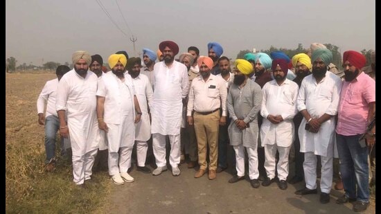 Punjab rural development and panchayats minister Kuldeep Singh Dhaliwal and other officials at Mand Chaunta village in Sahnewal, Ludhiana, where the land was freed from illegal possession. (HT Photo)