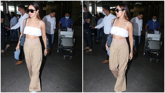 On Tuesday, paparazzi clicked Malaika, who is dating Arjun Kapoor, arriving at the Mumbai airport. She chose a trendy crop top and pants set for her jet-set look giving us tips on dressing comfortably for flights during summer without compromising on style. If you plan to upgrade your closet, don't forget to take styling tips from Malaika.(HT Photo/Varinder Chawla)