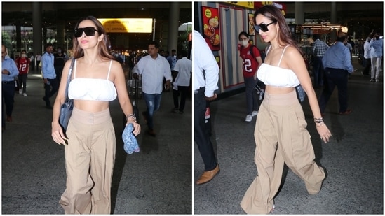 Malaika chose a breezy cotton fit in neutral shades. It features a statement crop top in a solid white shade. It comes with barely-there straps, a square neckline, cropped hem flaunting the star's toned midriff, a billowy silhouette creating a breezy effect, and ruched details on the torso.(HT Photo/Varinder Chawla)