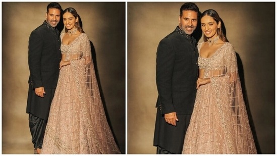 Akshay complemented his co-star in an all-black kurta and dhoti set. The star's outfit features a black bandhgala jacket with an embroidered neckline and buttoned-up front. He teamed with an asymmetric black kurta and matching silk dhoti and a pair of embellished juttis.(Instagram/@manushi_chhillar)