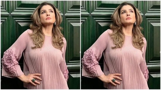 Raveena’s quarter-sleeved satin top came with pleat details and dramatic floral details near to the elbows. The trousers also featured pleat details.(Instagram/@officialraveenatandon)