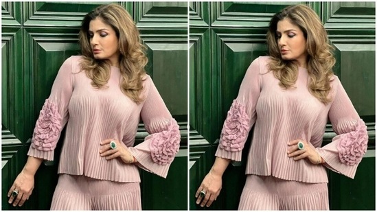 Styled by fashion stylist Sugandha Sood, Raveena wore her coloured tresses open in wavy curls with a side part.(Instagram/@officialraveenatandon)