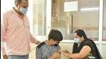 A doctor administers a dose of Covid-19 vaccine to a boy at MMG Hospital in Ghaziabad. (Sakib Ali/HT photo) A doctor administers a dose of Covid-19 vaccine to a boy at MMG Hospital in Ghaziabad. (Sakib Ali/HT photo)