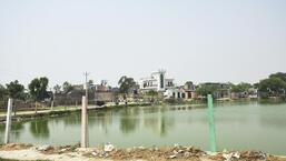 Ghaziabad, India - May 08, 2022: A view of a pond in Muradnagar Bhikanpur village, in Ghaziabad , India on Sunday, May 08, 2022. (Photo by Sakib Ali/Hindustan Times)