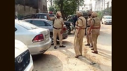 Police inspecting the spot where the robbery took place in Focal Point, Phase 7, Ludhiana, on Wednesday. (Harvinder SIngh/HT)