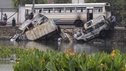 A damaged bus and burned out vehicles pushed into Beira Lake during protests in Colombo, Sri Lanka.