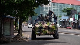 Sri Lankan army soldiers patrol during curfew in Colombo, Sri Lanka.