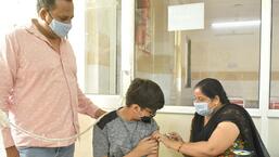 A doctor administers a dose of Covid-19 vaccine to a boy at MMG Hospital in Ghaziabad. (Sakib Ali/HT photo)