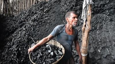 A labourer works at a coal wholesale market in Mumbai on Wednesday. Bhushan Koyande/ HT Photo A labourer works at a coal wholesale market in Mumbai on Wednesday. Bhushan Koyande/ HT Photo