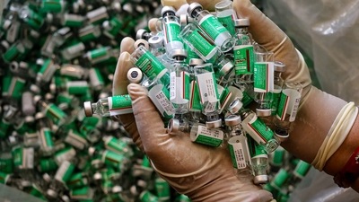 A healthworker shows empty vials of Covishield vaccine at a vaccination centre for the Covid in Jammu. (PTI) A healthworker shows empty vials of Covishield vaccine at a vaccination centre for the Covid in Jammu. (PTI)