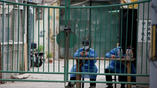 Security guards man a residential area under a Covid-19 coronavirus lockdown in Beijing.&nbsp;(AFP)