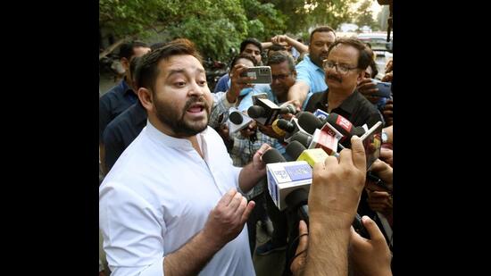 RJD MLA Tejashwi Yadav interacts with the media after meeting Bihar chief minister Nitish Kumar in Patna on Wednesday. (Santosh Kumar/HT Photo)