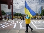 TOPSHOT - Ukrainians stage a protest outside of the United Nations Office during special session of the UN Human Rights Council on the war in Ukraine, in Geneva on May 12, 2022. - Ukraine slams what it calls the 