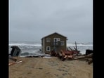 The image is taken from the viral video showing the house collapsing and floating in water.(Twitter/@CapeHatterasNPS)