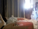 A Covid-19 patient lies in a bed in the acute care unit. A Covid-19 patient lies in a bed in the acute care unit. 