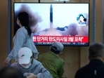 People watch a TV screen showing a news programme reporting about North Korea's missile launch with file footage, at a train station in Seoul, South Korea, Thursday, May 12, 2022. (AP/PTI) People watch a TV screen showing a news programme reporting about North Korea's missile launch with file footage, at a train station in Seoul, South Korea, Thursday, May 12, 2022. (AP/PTI)