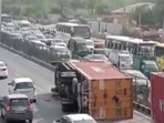 Visuals on ANI showed a truck lying overturned on the road, disrupting what appeared to be heavy traffic at that time. Visuals on ANI showed a truck lying overturned on the road, disrupting what appeared to be heavy traffic at that time.
