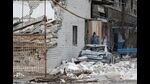 A local resident stands near an apartment building damaged during Ukraine-Russia conflict in Mariupol, Ukraine, 2022 (REUTERS)