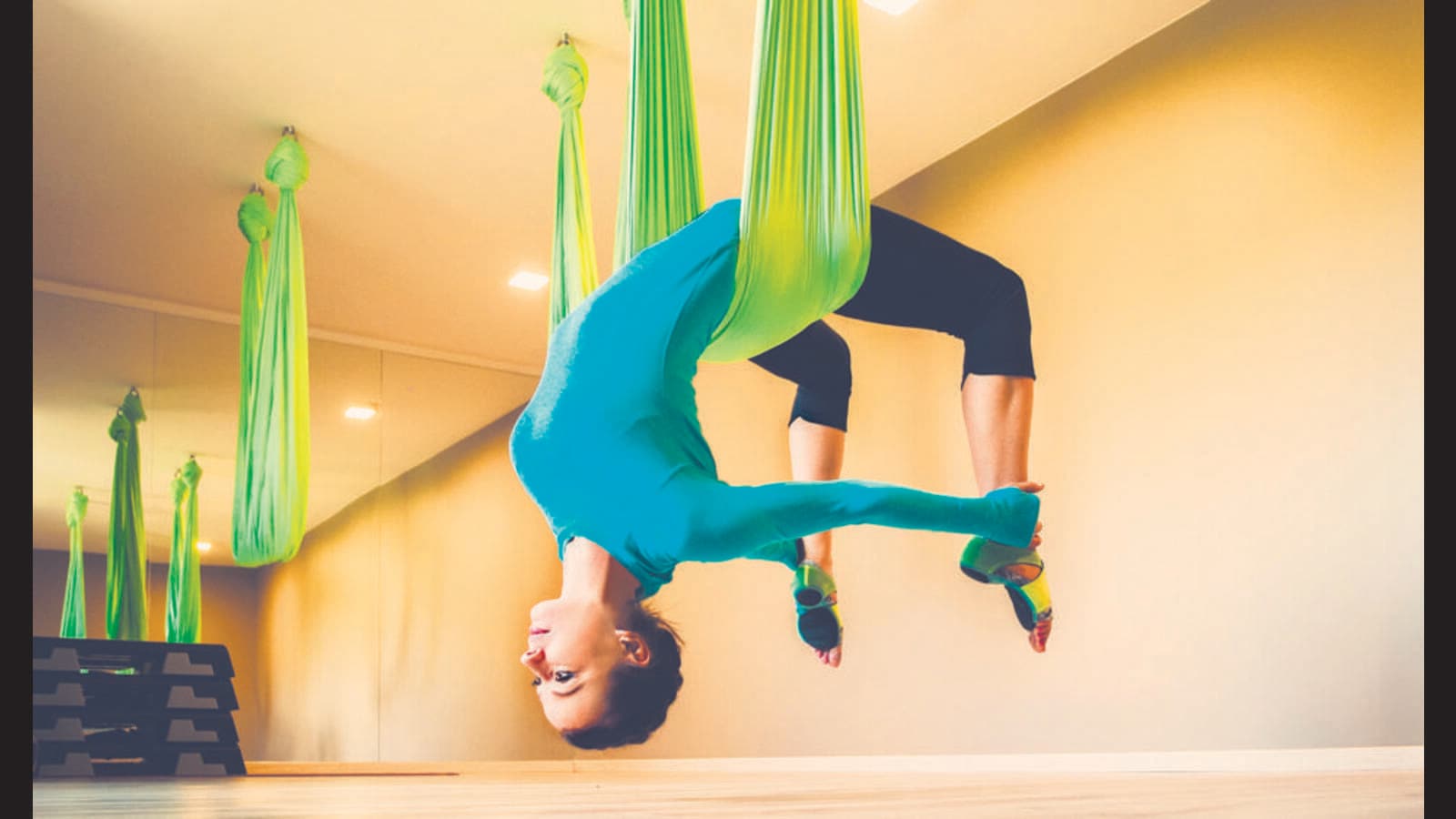 Yoga Pose: Hanging Sirsasana at 100th Monkey Yoga Studio