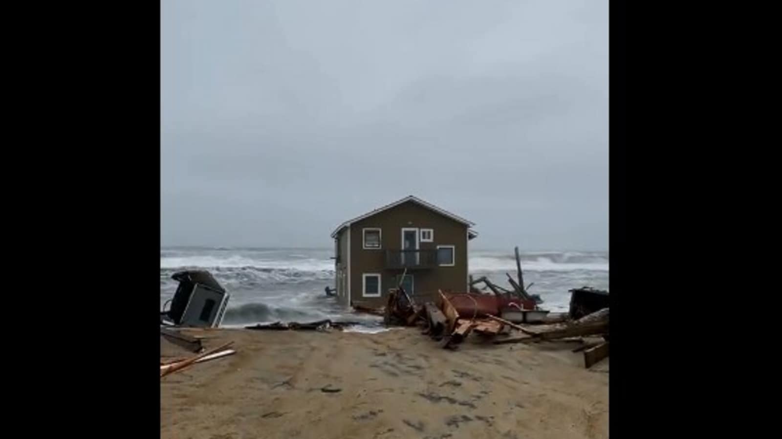 Unoccupied house in a US beach collapses and floats in water. Watch viral video