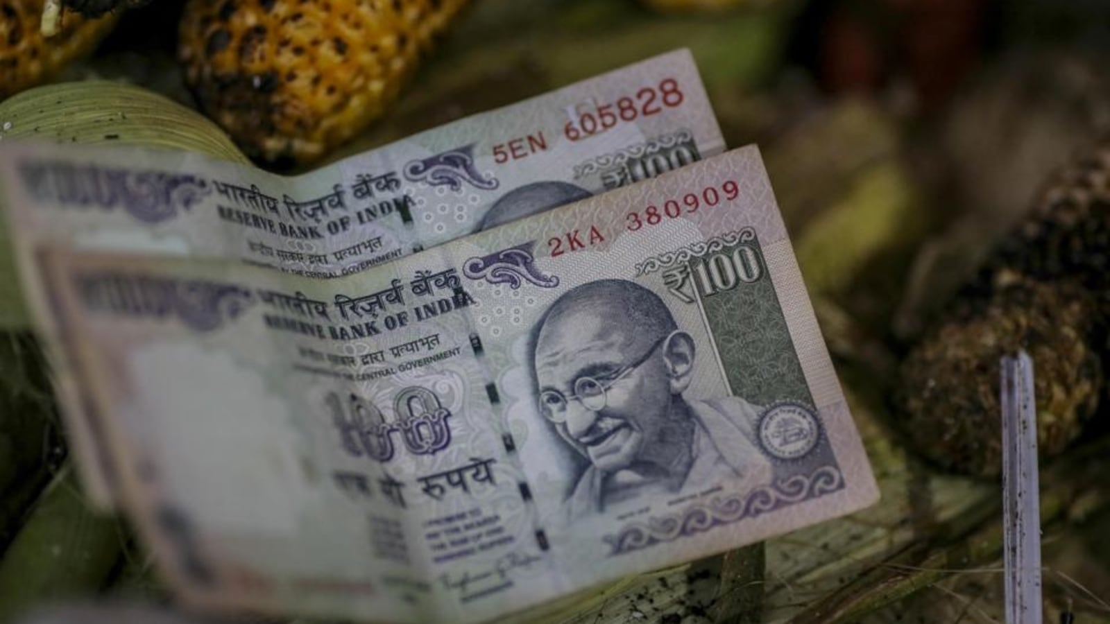 Rupee tumbles to a record low on inflation risks, stocks' decline