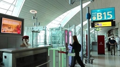 A woman enters the face and iris-recognition gate to board a plane at Dubai Airport. (AP / File) A woman enters the face and iris-recognition gate to board a plane at Dubai Airport. (AP / File)