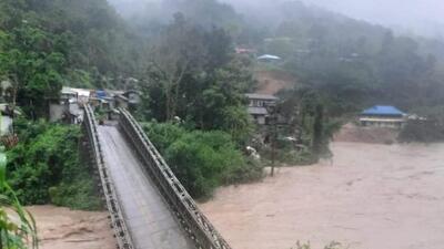 A Bailey bridge over Irang River collapsed as torrential rain washed away its foundation. A Bailey bridge over Irang River collapsed as torrential rain washed away its foundation.
