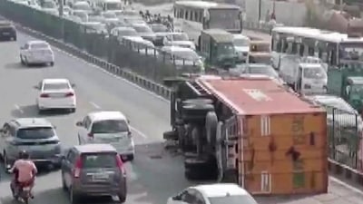Visuals on ANI showed a truck lying overturned on the road, disrupting what appeared to be heavy traffic at that time. Visuals on ANI showed a truck lying overturned on the road, disrupting what appeared to be heavy traffic at that time.