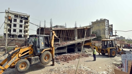 The demolition drive at Madanpur Khadar in Delhi on Thursday. (Sanjeev Verma/HT Photo)