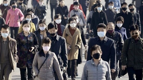 FILE PHOTO: People wearing protective face masks commute amid concerns over the new coronavirus disease (COVID-19) in Pyongyang, North Korea.(REUTERS)