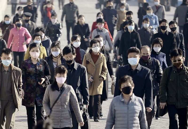 FILE PHOTO: People wearing protective face masks commute amid concerns over the new coronavirus disease (COVID-19) in Pyongyang, North Korea. (REUTERS)