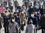 FILE PHOTO: People wearing protective face masks commute amid concerns over the new coronavirus disease (COVID-19) in Pyongyang, North Korea.