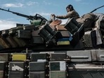 A Ukrainian soldier sits on a tank carryied by a transporter near Bakhmut, eastern Ukraine, on May 12, 2022. (AFP) A Ukrainian soldier sits on a tank carryied by a transporter near Bakhmut, eastern Ukraine, on May 12, 2022. (AFP)
