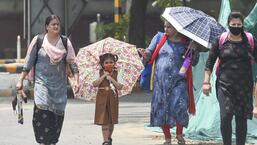 New Delhi, India - May 13, 2022: Pedestrians on a hot summer day at Mandi House area in New Delhi, India, on Friday, May 13, 2022. (Photo by Raj K Raj/ Hindustan Times) (Hindustan Times)