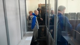 Russian army Sergeant Vadim Shishimarin, 21, is seen behind a glass during a court hearing in Kyiv, Ukraine.