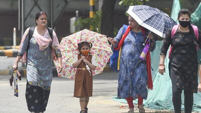 New Delhi, India - May 13, 2022: Pedestrians on a hot summer day at Mandi House area in New Delhi, India, on Friday, May 13, 2022. (Photo by Raj K Raj/ Hindustan Times) (Hindustan Times)